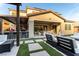 Lovely backyard with an outdoor kitchen, seating area, and manicured landscaping at 3929 Reyes Ave, Las Vegas, NV 89141