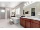 This elegant primary bathroom features a soaking tub, double vanity, and a separate walk-in shower at 3929 Reyes Ave, Las Vegas, NV 89141