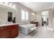 This primary bathroom includes a soaking tub, double vanity, and plentiful natural light through shuttered windows at 3929 Reyes Ave, Las Vegas, NV 89141