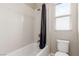 Clean and functional bathroom with a bathtub, shower, and toilet, designed for everyday convenience at 3929 Reyes Ave, Las Vegas, NV 89141