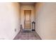 View of the front door with a small Buddha statue and decorative lantern on a brick pathway at 3929 Reyes Ave, Las Vegas, NV 89141