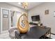 Refined home office boasting elegant decor, a decorative sculpture, and a staircase view creating an inspiring work environment at 3929 Reyes Ave, Las Vegas, NV 89141