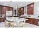 Modern kitchen featuring stainless steel appliances, center island, and dark wood cabinets at 3929 Reyes Ave, Las Vegas, NV 89141