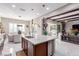 Bright, open-concept kitchen showcasing a large island with stainless steel appliances and adjacent dining area at 3929 Reyes Ave, Las Vegas, NV 89141