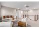A spacious living room with stylish decor, modern railing, and plush seating area providing a comfortable retreat at 3929 Reyes Ave, Las Vegas, NV 89141