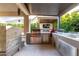 Spacious outdoor kitchen with a grill, sink, and ample counter space for entertaining at 3929 Reyes Ave, Las Vegas, NV 89141