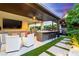Spectacular outdoor kitchen and entertainment space with a bar, grilling area, and comfortable seating at 3929 Reyes Ave, Las Vegas, NV 89141