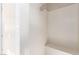 This walk-in shower features white tiled walls, a built-in bench, and a modern shower head at 3929 Reyes Ave, Las Vegas, NV 89141