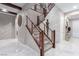 Staircase with wood and metal railings leading to the upper floors, tile floors at 3929 Reyes Ave, Las Vegas, NV 89141