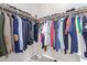 Efficiently designed closet with shelving, clothes, and shoes, providing ample storage and organization options at 3929 Reyes Ave, Las Vegas, NV 89141