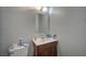 Small bathroom featuring dark wood vanity and basic mirror at 4 Britz Cir, North Las Vegas, NV 89030
