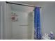 Clean, white shower and tub combination with blue and white curtain at 4 Britz Cir, North Las Vegas, NV 89030