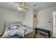 Bedroom features ceiling fan, hardwood flooring, and is well-lit at 4 Britz Cir, North Las Vegas, NV 89030