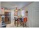 Cozy dining area featuring a dining table with seating for four, plus a stainless-steel refrigerator at 4 Britz Cir, North Las Vegas, NV 89030