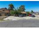 A well-placed view of the property, showcasing the dwelling, yard and several parked vehicles in the driveway at 4 Britz Cir, North Las Vegas, NV 89030