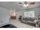 Inviting living space showcasing tile floors, a dining area, and comfortable seating arrangements at 4 Britz Cir, North Las Vegas, NV 89030