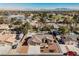 Aerial view of the landscaped home, featuring a backyard pool and mature desert landscaping at 4016 Tyler William Ln, Las Vegas, NV 89130