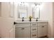 Bathroom features a double sink vanity with light gray cabinets and black fixtures at 4016 Tyler William Ln, Las Vegas, NV 89130