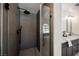 Modern bathroom features a stylish glass shower, elegant vanity, and contemporary fixtures at 4016 Tyler William Ln, Las Vegas, NV 89130