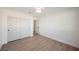 Empty bedroom featuring wood-look floors, and standard double door closet at 4016 Tyler William Ln, Las Vegas, NV 89130