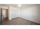 Bright bedroom features wood-look floors, a closet with white doors and fresh white paint at 4016 Tyler William Ln, Las Vegas, NV 89130