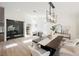 Dining room showcasing modern lighting, ample seating, and access to an outdoor space at 4016 Tyler William Ln, Las Vegas, NV 89130