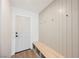 Entryway with bench and coat hooks on paneled wall, offers style and functionality at 4016 Tyler William Ln, Las Vegas, NV 89130