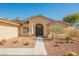 Inviting front entrance with rock landscaping and a covered entryway at 4016 Tyler William Ln, Las Vegas, NV 89130