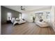 Spacious main bedroom showcases a relaxing sitting area with bay windows and an elegant accent wall at 4016 Tyler William Ln, Las Vegas, NV 89130