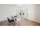 Bright office space features double doors, a modern light fixture, and stylish desk with natural light at 4016 Tyler William Ln, Las Vegas, NV 89130