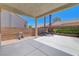 Covered patio area with a concrete floor and well-maintained backyard at 4197 Bottiglia Ave, Las Vegas, NV 89141