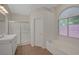 Bright bathroom with tub, walk-in shower, single sink vanity, and natural light at 4197 Bottiglia Ave, Las Vegas, NV 89141