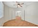 Bedroom with laminate floors and french doors leading to the main living space at 4197 Bottiglia Ave, Las Vegas, NV 89141