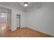 Cozy bedroom with wood floors, a ceiling fan, and a convenient closet for storage at 4197 Bottiglia Ave, Las Vegas, NV 89141
