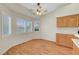 Cozy breakfast nook featuring wood floors, bright windows, and built-in cabinets at 4197 Bottiglia Ave, Las Vegas, NV 89141