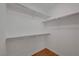 Walk-in closet with shelves for storage and hanging rods at 4197 Bottiglia Ave, Las Vegas, NV 89141