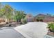 Charming one-story home with a two-car garage, desert landscaping, and a spacious driveway at 4197 Bottiglia Ave, Las Vegas, NV 89141