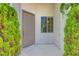 Charming home entrance with well-maintained front door and lush greenery at 4197 Bottiglia Ave, Las Vegas, NV 89141