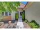Front entrance with desert landscaping and lush greenery, and walkway to door at 4197 Bottiglia Ave, Las Vegas, NV 89141