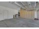 Spacious garage with concrete floors and built-in storage cabinets along the back wall at 4197 Bottiglia Ave, Las Vegas, NV 89141