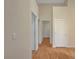 Spacious hallway with hardwood floors and multiple doorways leading to different rooms at 4197 Bottiglia Ave, Las Vegas, NV 89141