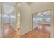 Bright hallway featuring wood floors, doors to different rooms, and plenty of natural light at 4197 Bottiglia Ave, Las Vegas, NV 89141
