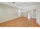 Bright living room featuring wood floors, large windows, and an open floor plan at 4197 Bottiglia Ave, Las Vegas, NV 89141