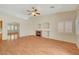 Spacious living room with fireplace, wood floors, and seamless access to other living areas at 4197 Bottiglia Ave, Las Vegas, NV 89141