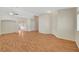 Open living room with neutral walls and flooring; versatile space for entertaining guests or relaxing with Gathering at 4197 Bottiglia Ave, Las Vegas, NV 89141