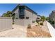 The backyard features low-maintenance landscaping, a fence and a view of the home's back exterior at 4519 Sapphire Moon Ave, North Las Vegas, NV 89084