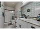 Well-lit bathroom with a granite countertop, modern fixtures, and charming blue-themed decor at 4519 Sapphire Moon Ave, North Las Vegas, NV 89084