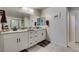 Modern bathroom featuring double vanity, granite counters and walk-in shower at 4519 Sapphire Moon Ave, North Las Vegas, NV 89084