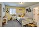 Bright bedroom with a playful decor, carpet flooring, and neutral walls at 4519 Sapphire Moon Ave, North Las Vegas, NV 89084