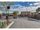 Gated entrance to the community featuring brick pillars, iron gate, and landscaped surroundings for added security at 4519 Sapphire Moon Ave, North Las Vegas, NV 89084